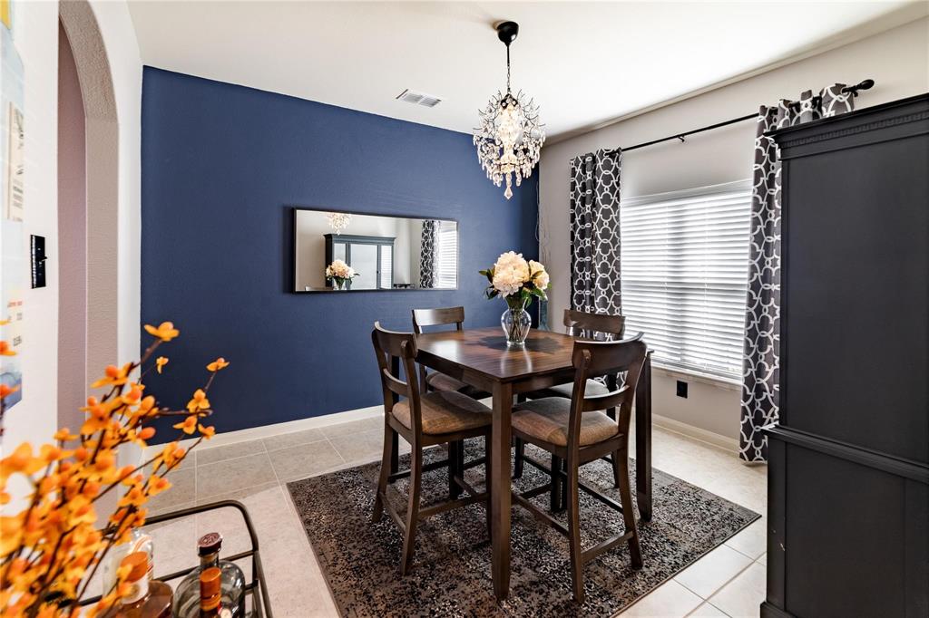 3021 Earl Road Anna, TX 75409 - Photo 5 of 20 a view of a dining room with furniture and chandelier