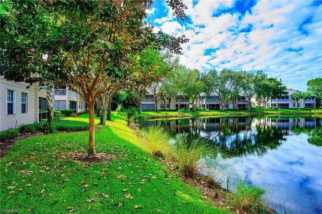 a view of a lake with a house in the background
