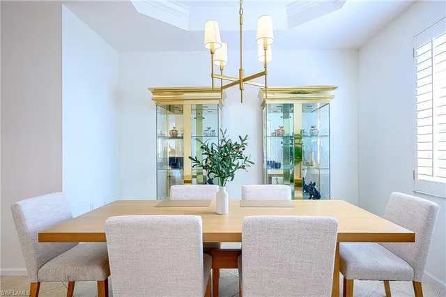 a view of a dining room with furniture and a window