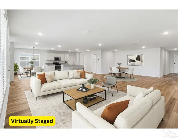 a view of kitchen with kitchen island wooden floor window and refrigerator