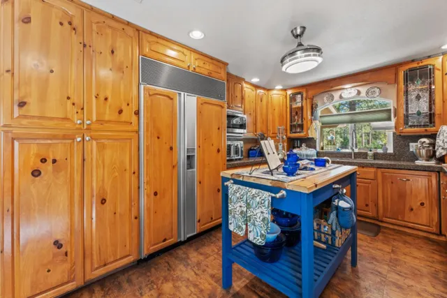 a bed room with a bed and a chair