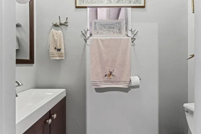 a view of a table and chairs under an umbrella