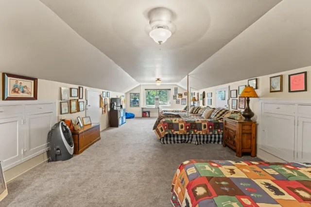a view of a house with a yard and sitting area