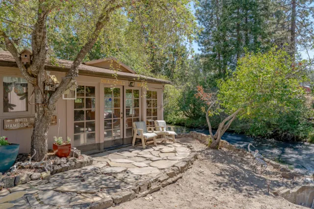 a backyard of a house with oven and garden