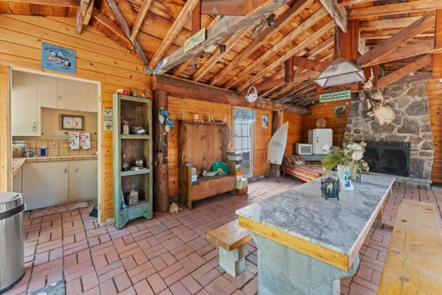 a backyard of a house with outdoor seating