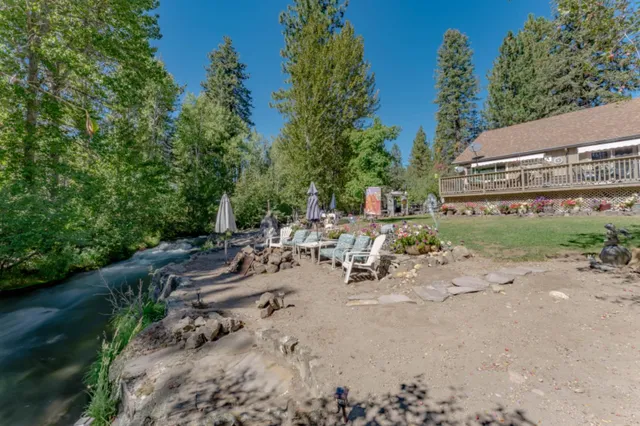 a view of a backyard with a sitting area and furniture