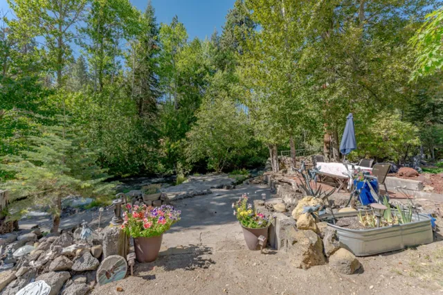 an aerial view of a house with yard swimming pool and outdoor seating