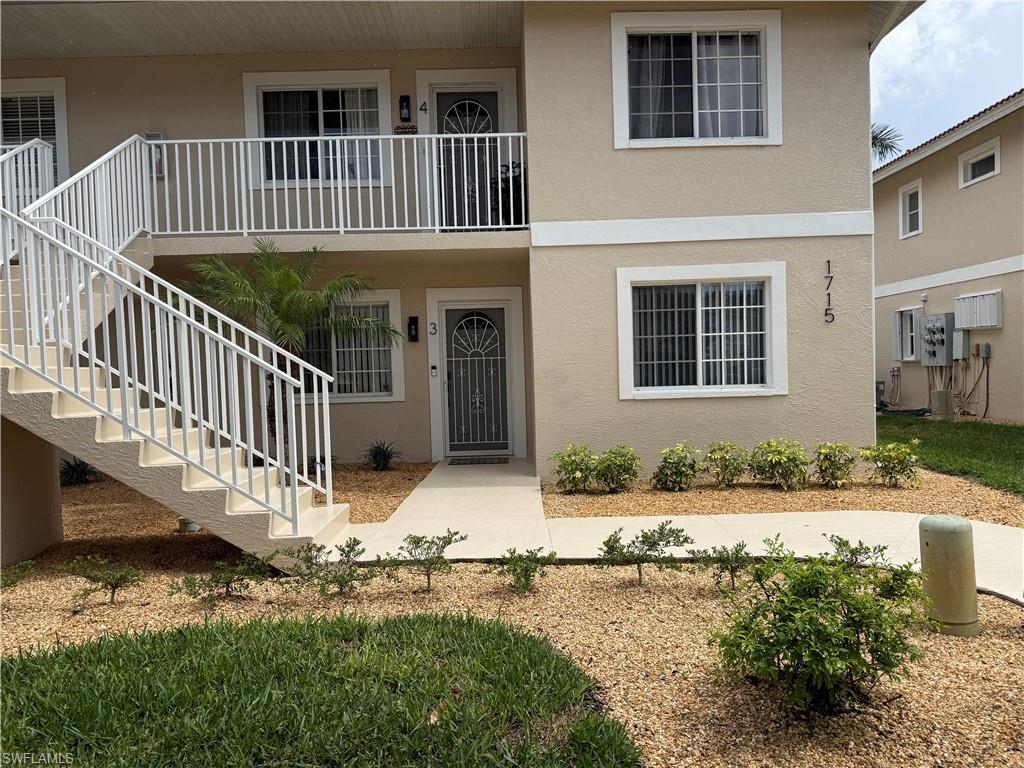 1715 Reuven Circle, Unit 2103 Naples, FL 34112 - Photo 1 of 40 a view of house with deck and yard
