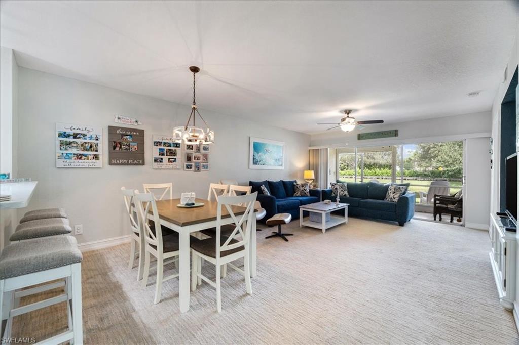 1715 Reuven Circle, Unit 2103 Naples, FL 34112 - Photo 11 of 38 a view of a dining room with furniture window and outside view