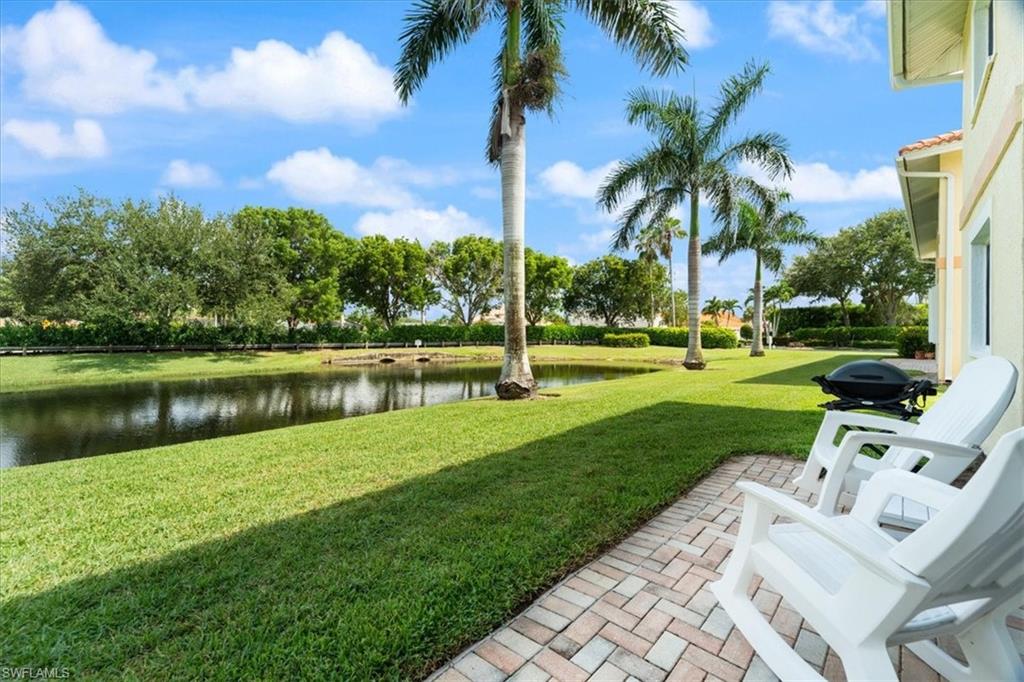 1715 Reuven Circle, Unit 2103 Naples, FL 34112 - Photo 14 of 38 a view of a park with a lake view