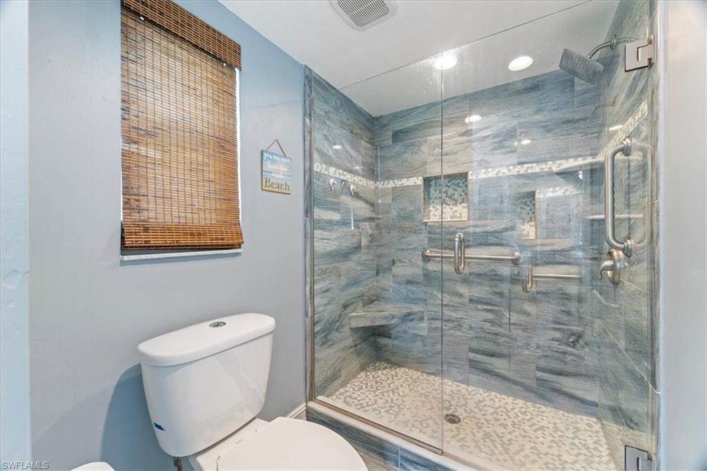 1715 Reuven Circle, Unit 2103 Naples, FL 34112 - Photo 18 of 38 Bathroom with toilet and a stall shower