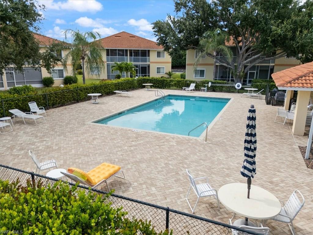 1715 Reuven Circle, Unit 2103 Naples, FL 34112 - Photo 23 of 38 a view of outdoor space yard and swimming pool