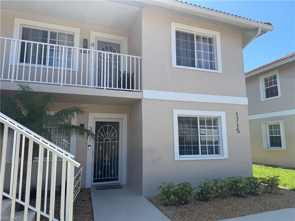 1715 Reuven Circle, Unit 2103 Naples, FL 34112 - Photo 26 of 40 a view of front door of house