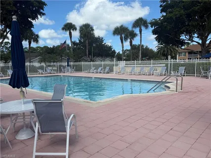 a view of a swimming pool with a lounge chair