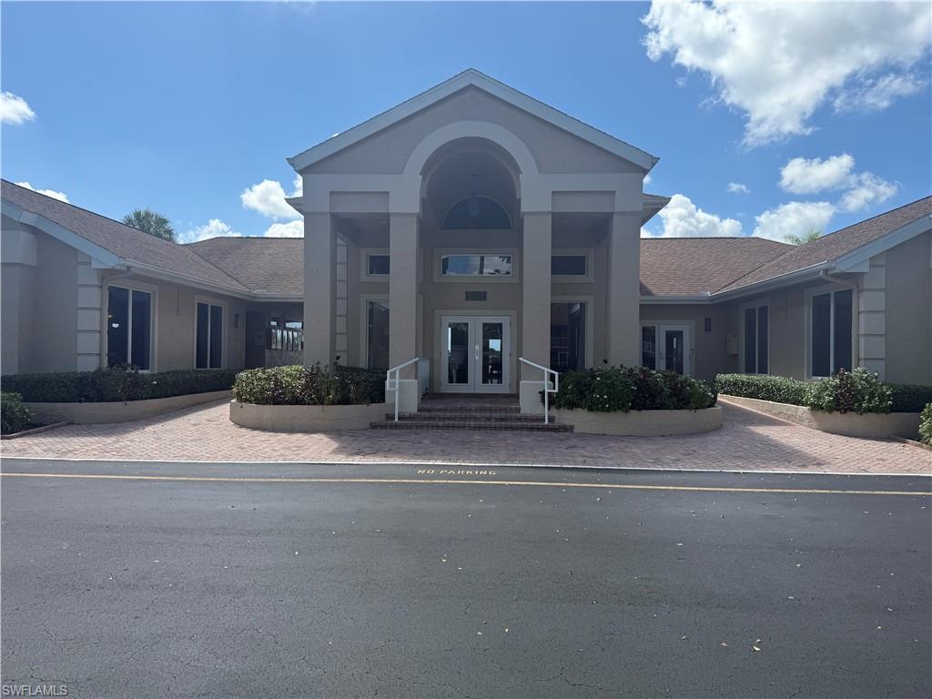 1715 Reuven Circle, Unit 2103 Naples, FL 34112 - Photo 34 of 38 a view of a house with a street