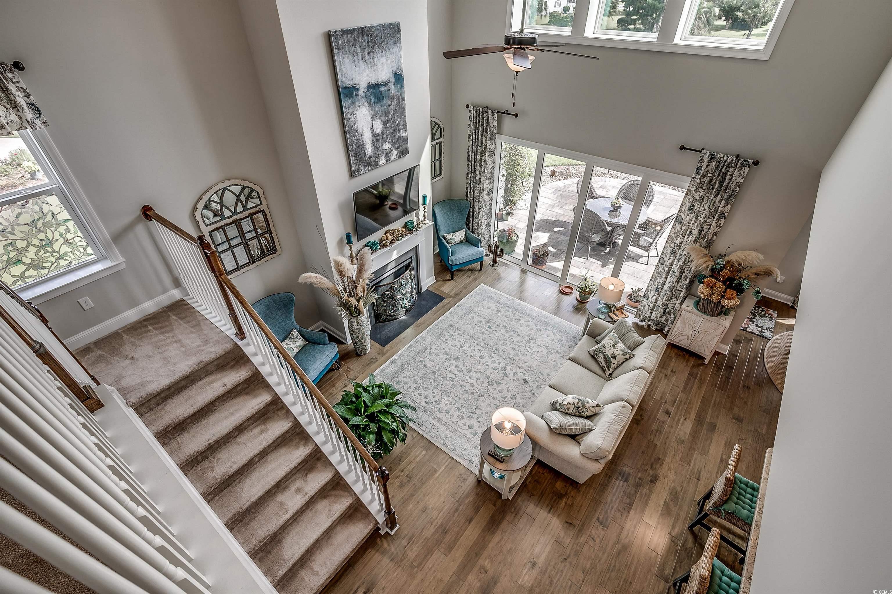 925 Abernathy Place Surfside Beach, SC 29575 - Photo 18 of 40 Living room featuring a towering ceiling, plenty o