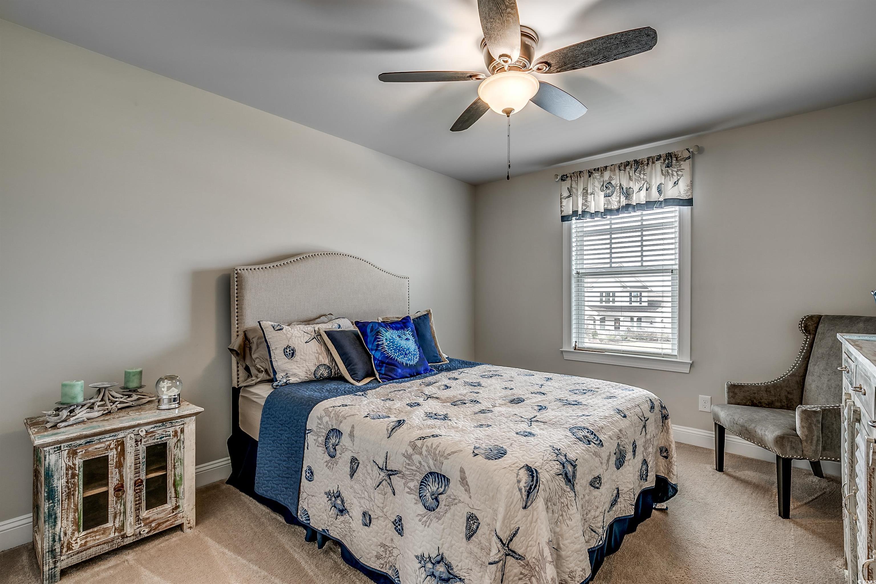 925 Abernathy Place Surfside Beach, SC 29575 - Photo 19 of 40 Bedroom featuring light carpet, baseboards, and a