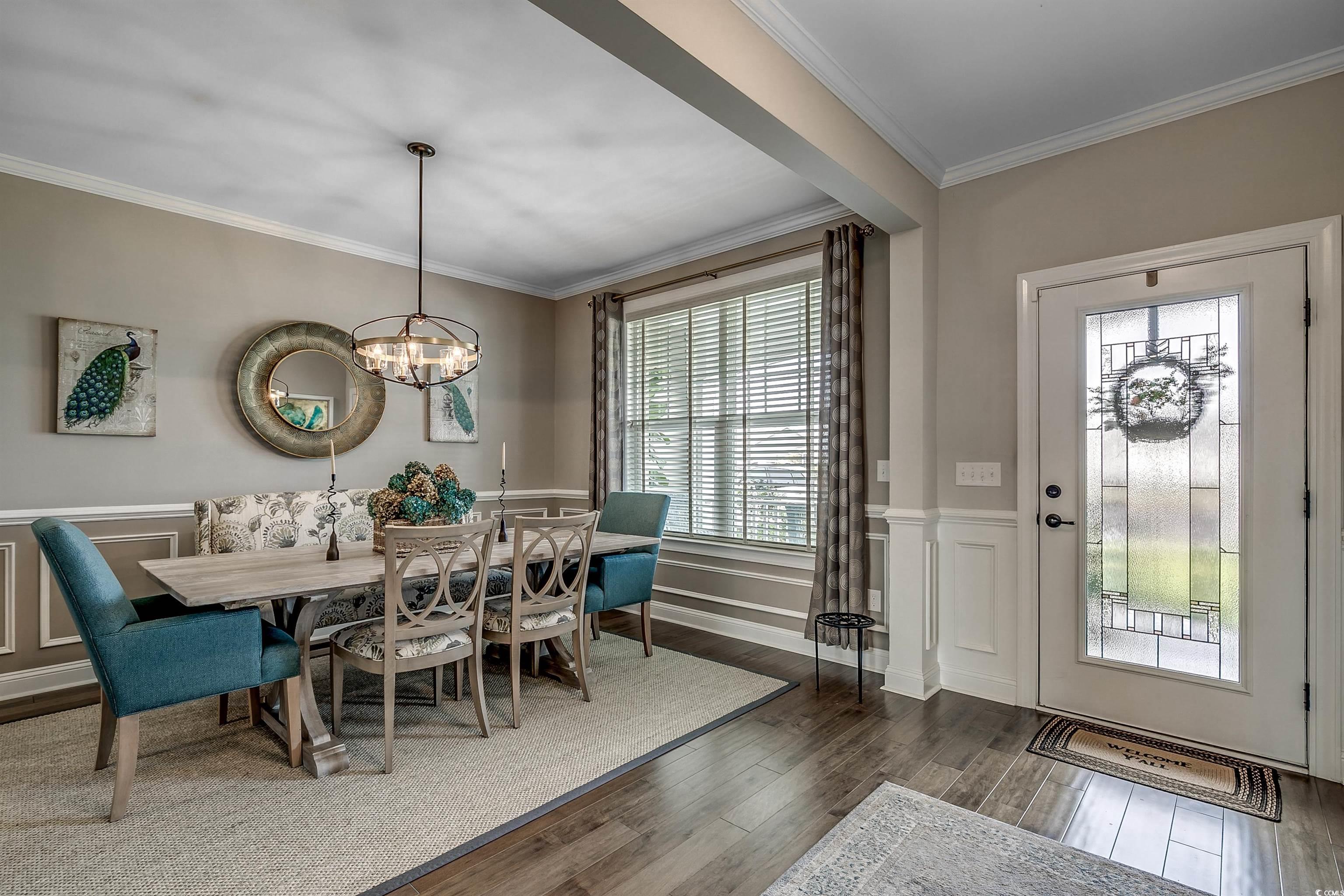 925 Abernathy Place Surfside Beach, SC 29575 - Photo 2 of 40 Dining area with a chandelier, ornamental molding,