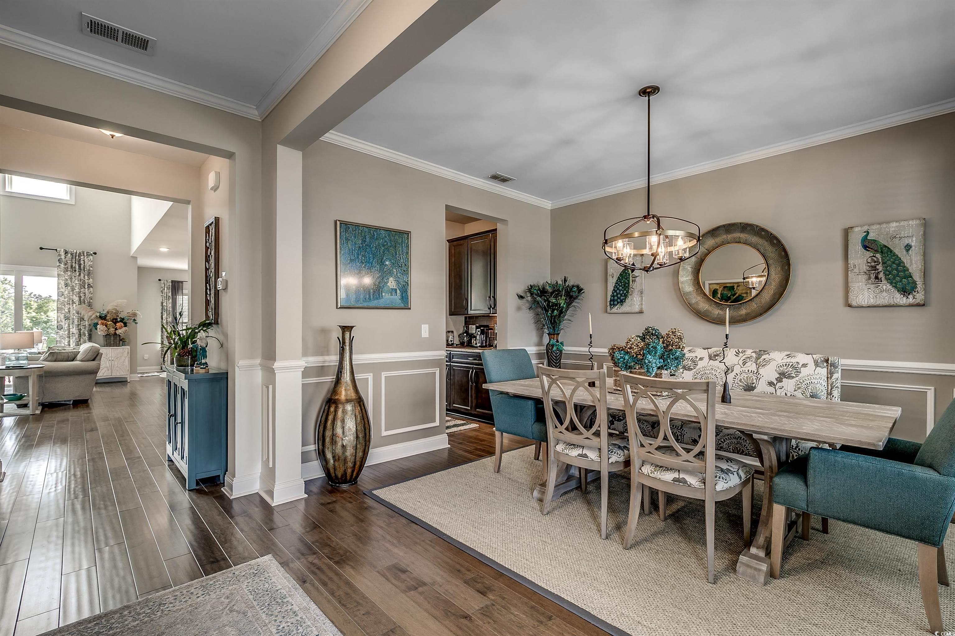 925 Abernathy Place Surfside Beach, SC 29575 - Photo 3 of 40 Dining area with dark wood finished floors, a chan