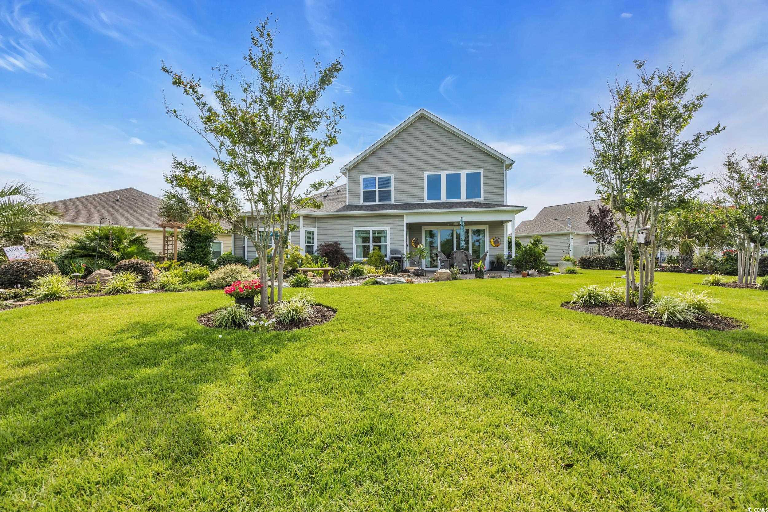 925 Abernathy Place Surfside Beach, SC 29575 - Photo 34 of 40 Back of house with a yard