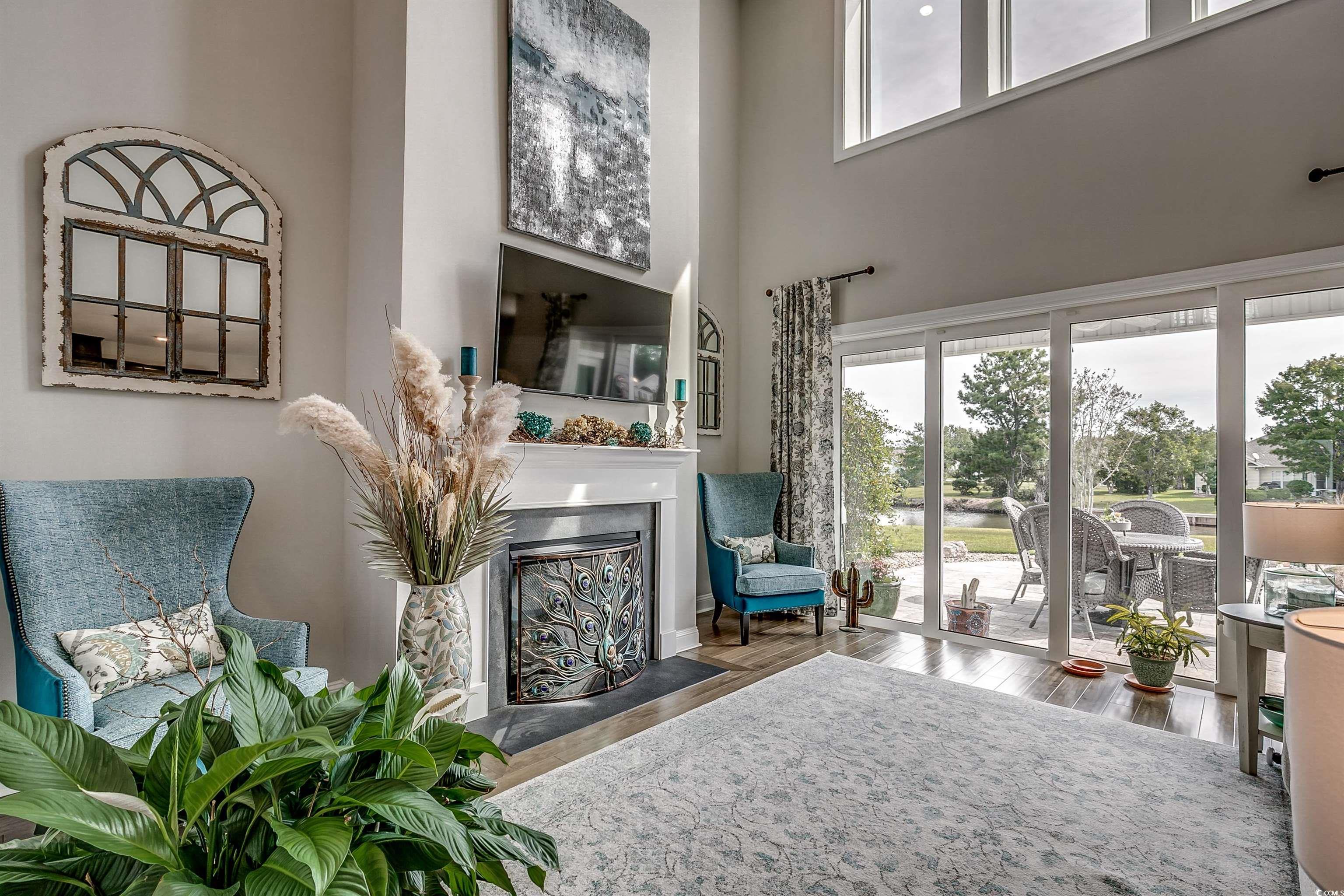 925 Abernathy Place Surfside Beach, SC 29575 - Photo 8 of 40 Living room with a towering ceiling, wood finished