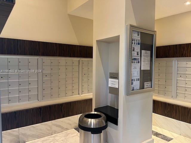 185 Southwest 7th Street, Unit 1403 Miami, FL 33130 - Photo 23 of 31 a bathroom with a sink and a mirror