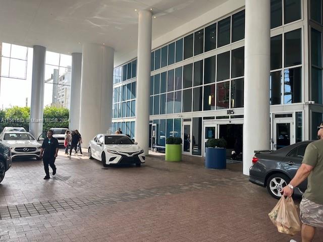 185 Southwest 7th Street, Unit 1403 Miami, FL 33130 - Photo 29 of 31 a living room with furniture and a floor to ceiling window
