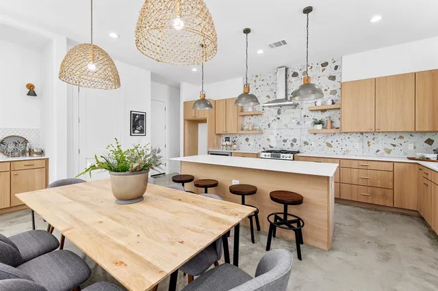 a kitchen with a table and chairs in it