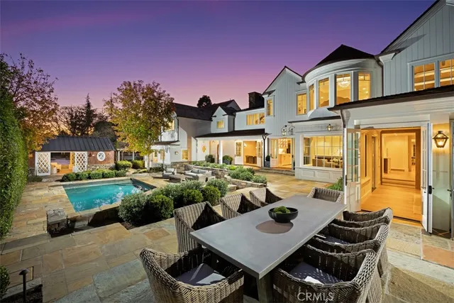 a view of a patio with couches chairs and a potted plant
