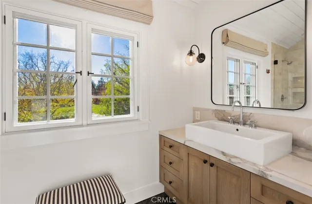 a bathroom with a sink and a mirror
