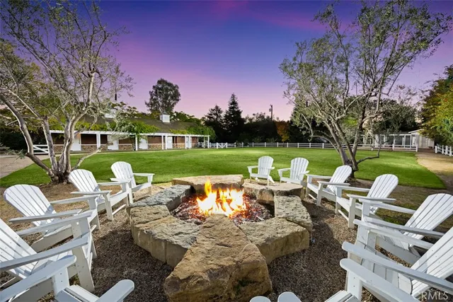 a view of a chairs and table in patio