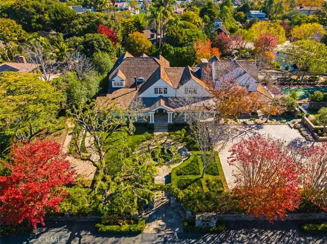 a aerial view of a house with a yard and garden
