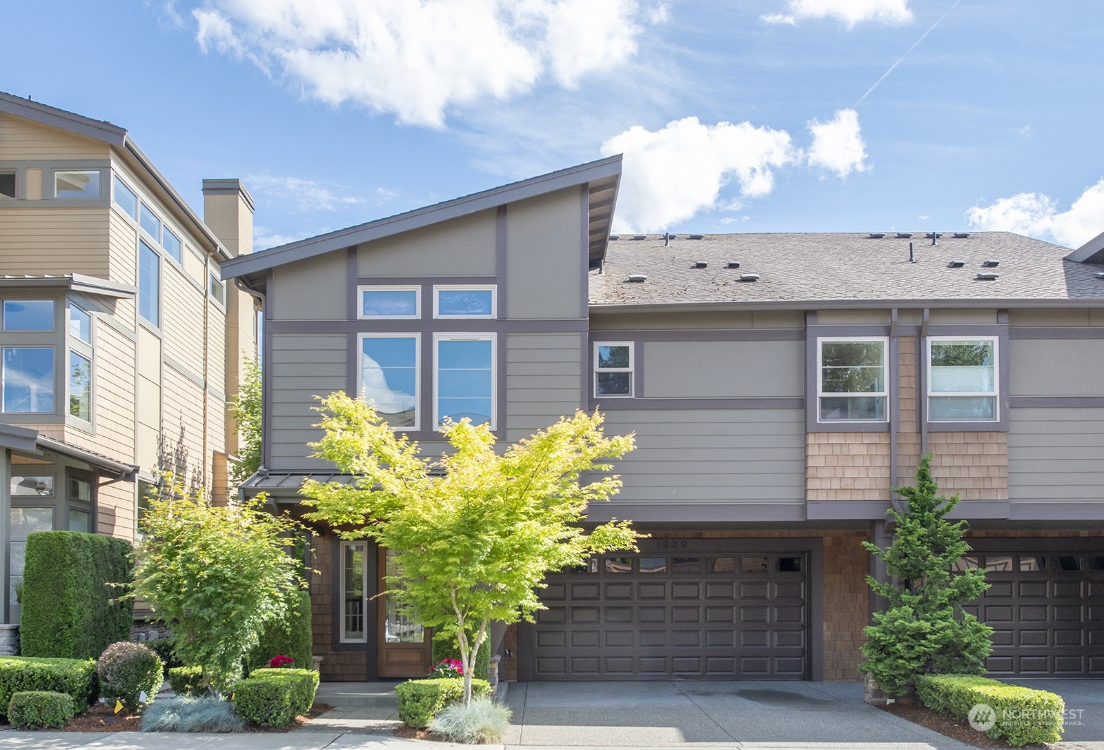 1229 North 42nd Place Renton, WA 98056 - Photo 1 of 40 a front view of a house with a yard