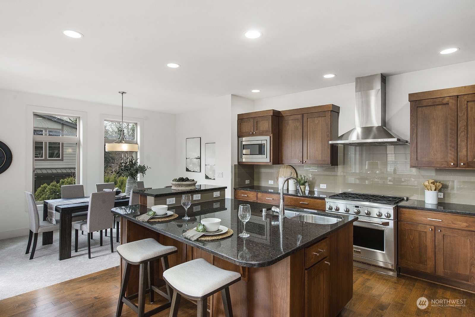 1229 North 42nd Place Renton, WA 98056 - Photo 11 of 40 a kitchen with granite countertop a sink and cabinets