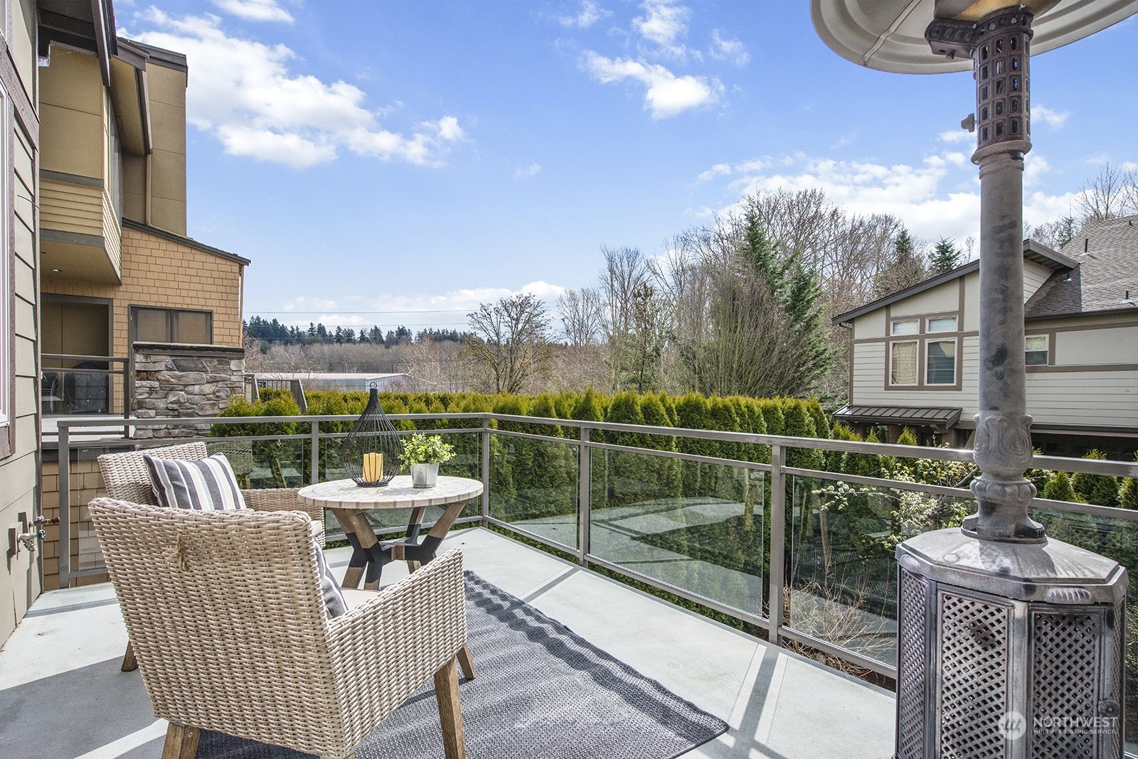 1229 North 42nd Place Renton, WA 98056 - Photo 18 of 40 a view of a roof deck with couches and potted plants