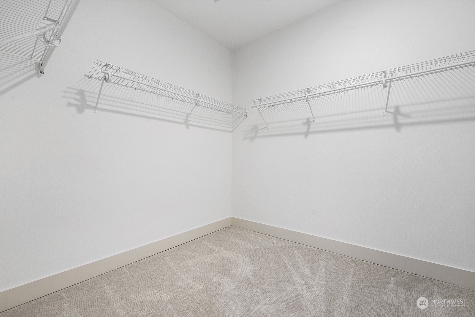 1229 North 42nd Place Renton, WA 98056 - Photo 27 of 40 a view of a room with racks on the wall