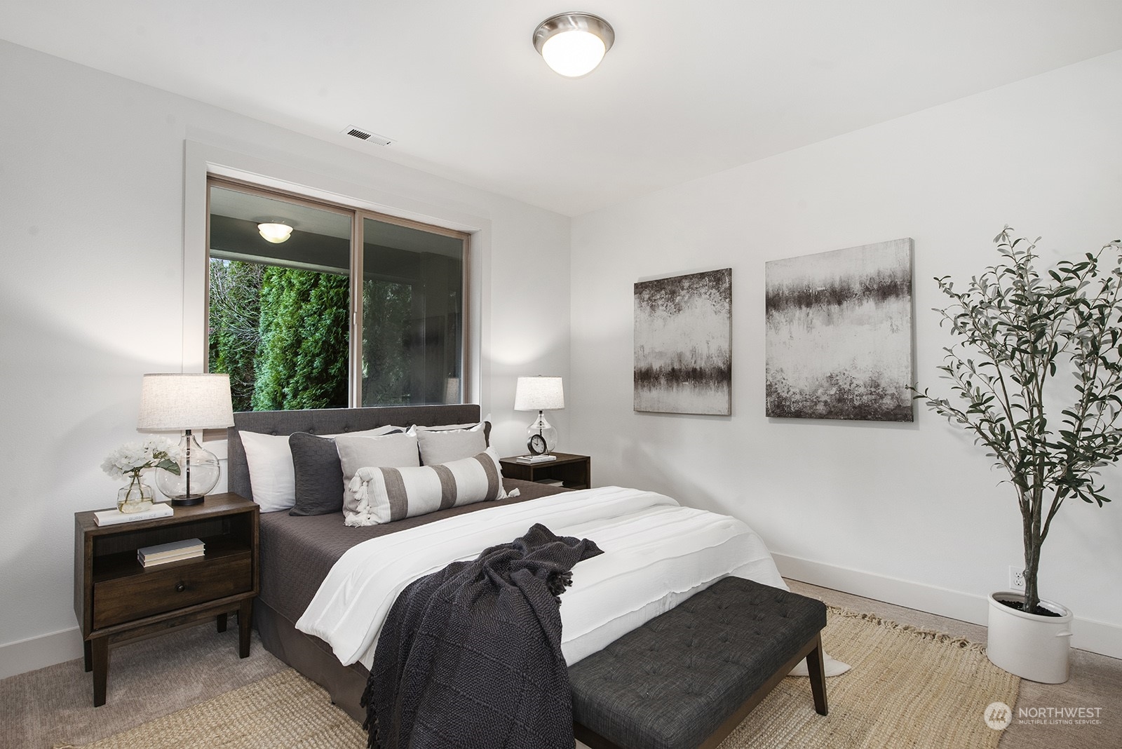 1229 North 42nd Place Renton, WA 98056 - Photo 31 of 40 a bedroom with a bed and a window