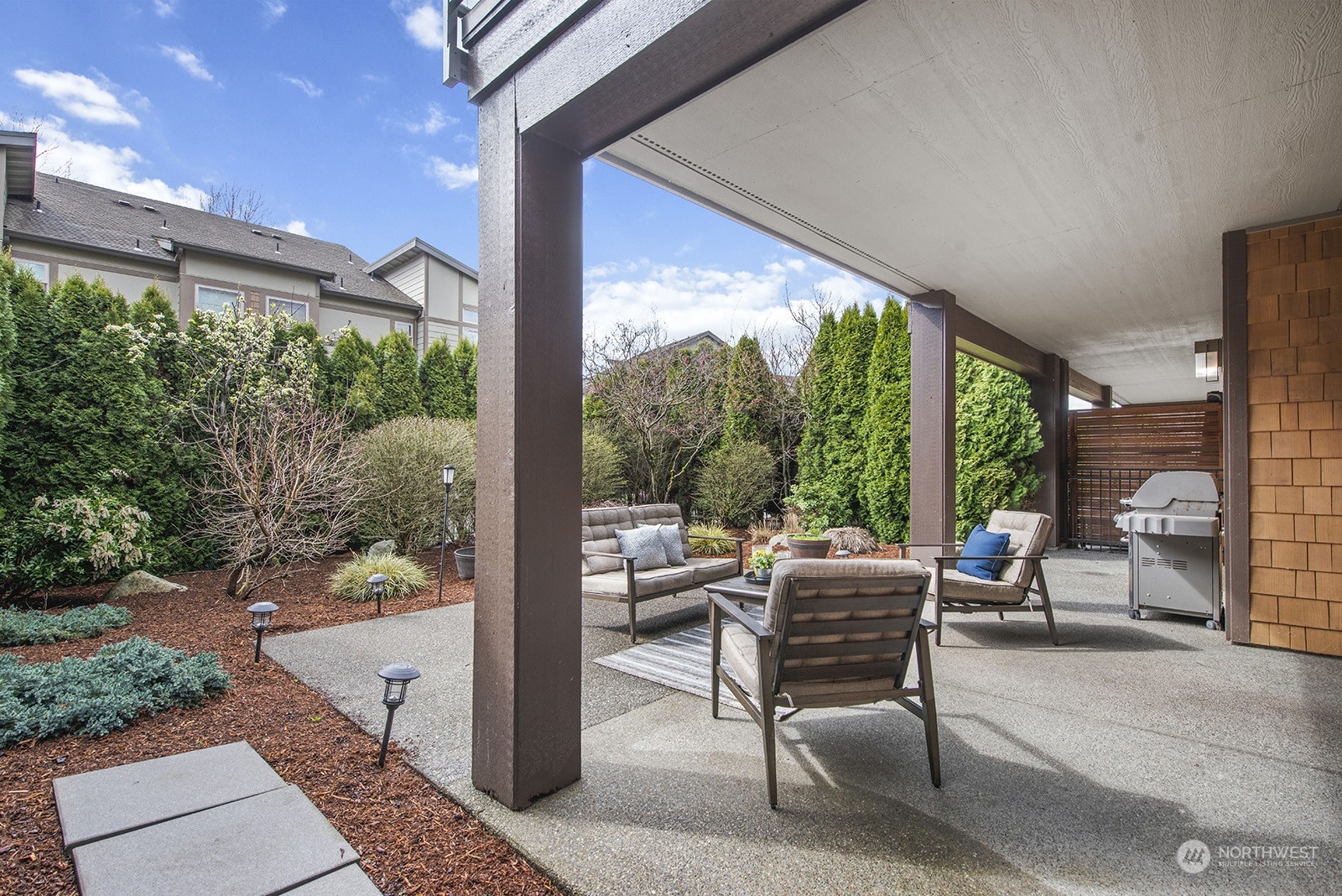 1229 North 42nd Place Renton, WA 98056 - Photo 34 of 40 a view of a patio with a dining table and chairs