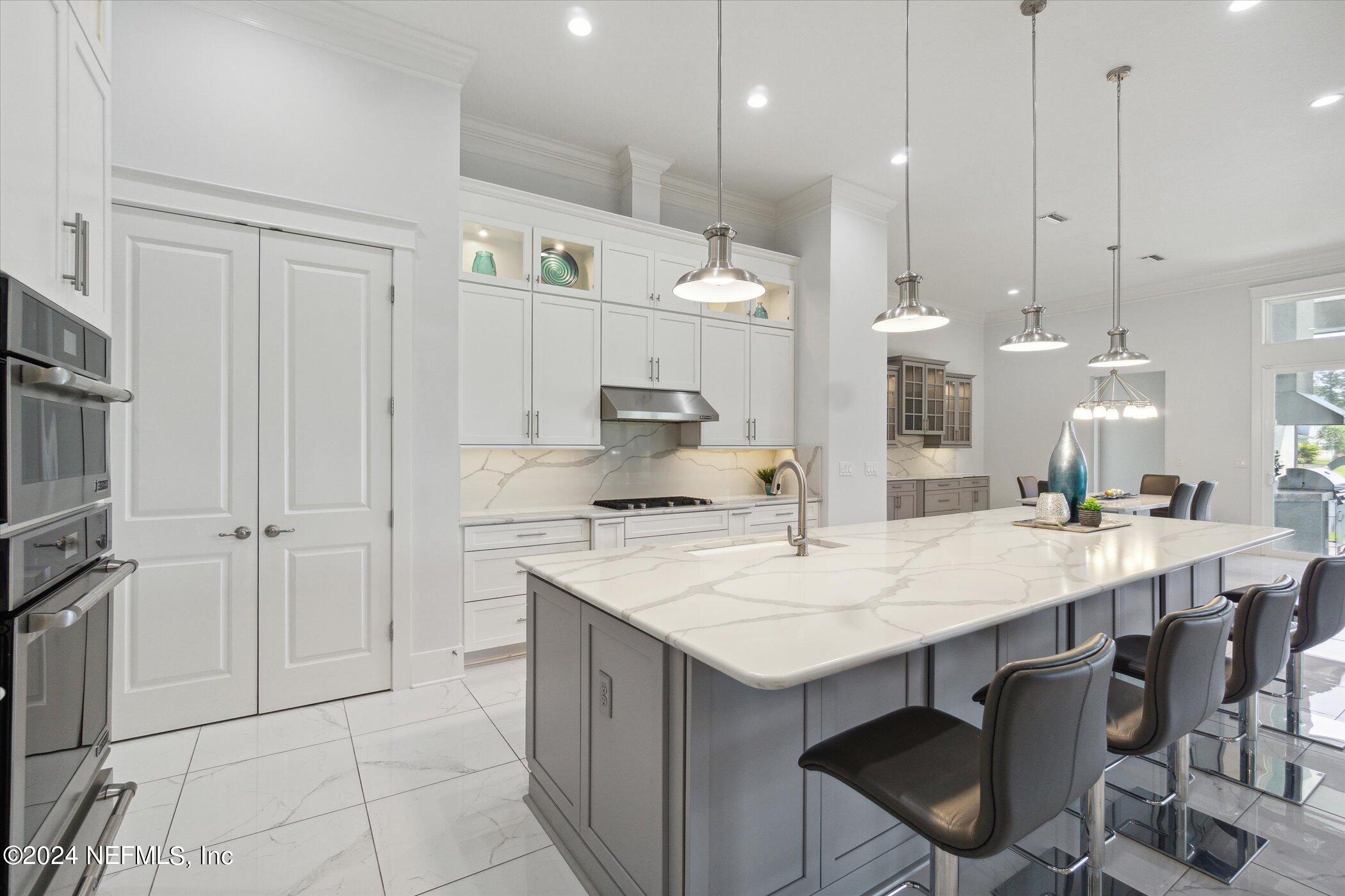 522 Old Bluff Drive Ponte Vedra, FL 32081 - Photo 20 of 93 a large kitchen with a table and chairs