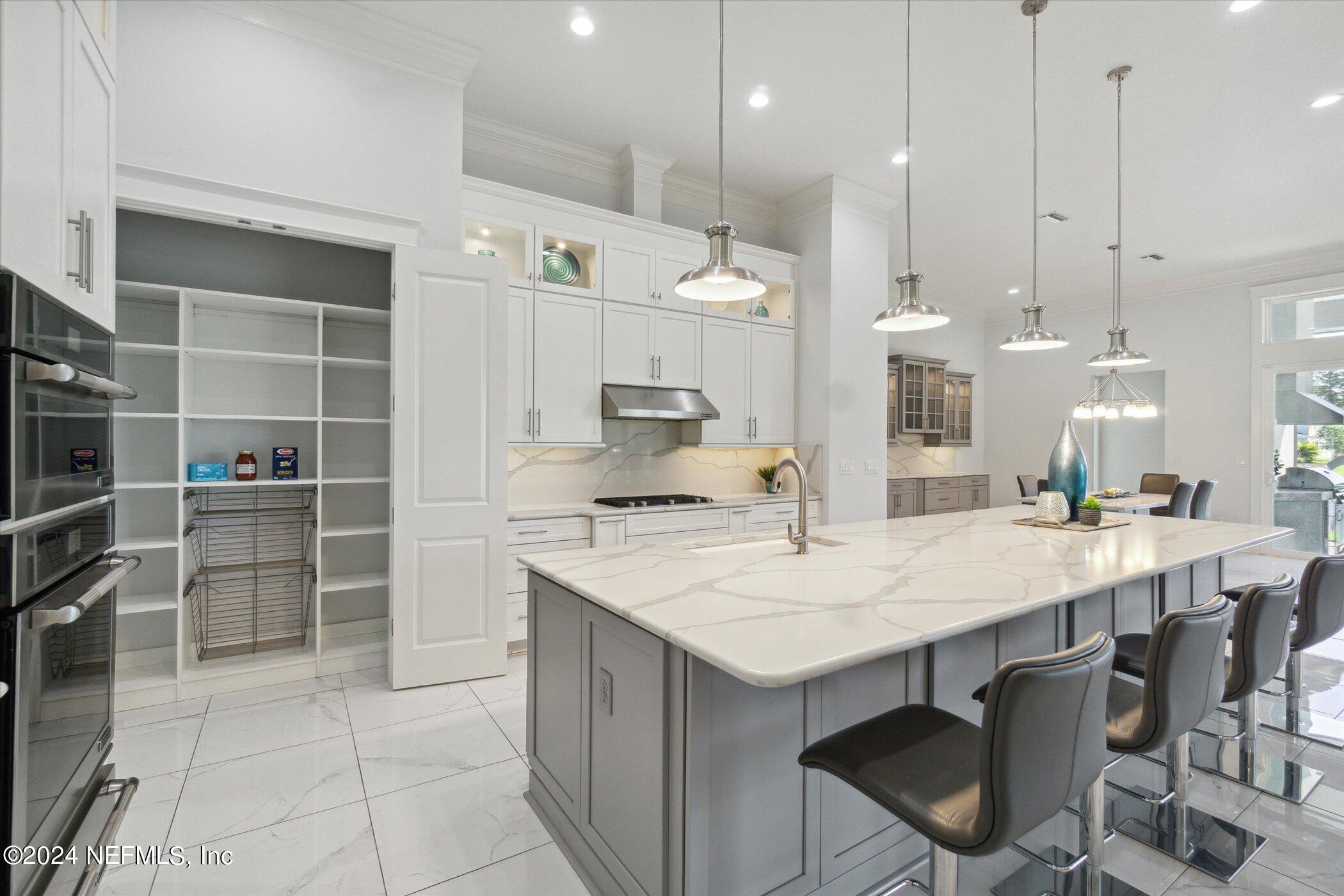 522 Old Bluff Drive Ponte Vedra, FL 32081 - Photo 21 of 93 a large kitchen with a table and chairs