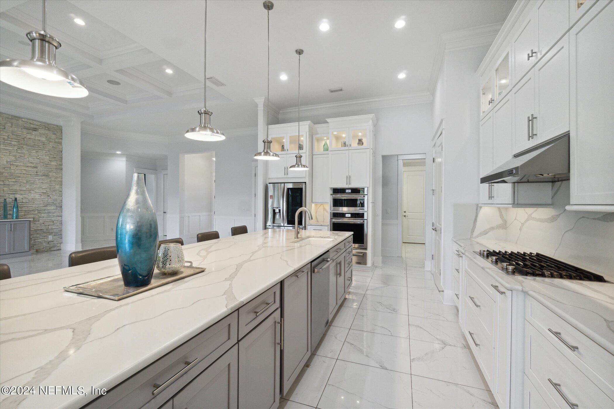 522 Old Bluff Drive Ponte Vedra, FL 32081 - Photo 22 of 93 a kitchen with counter top space cabinets and stainless steel appliances