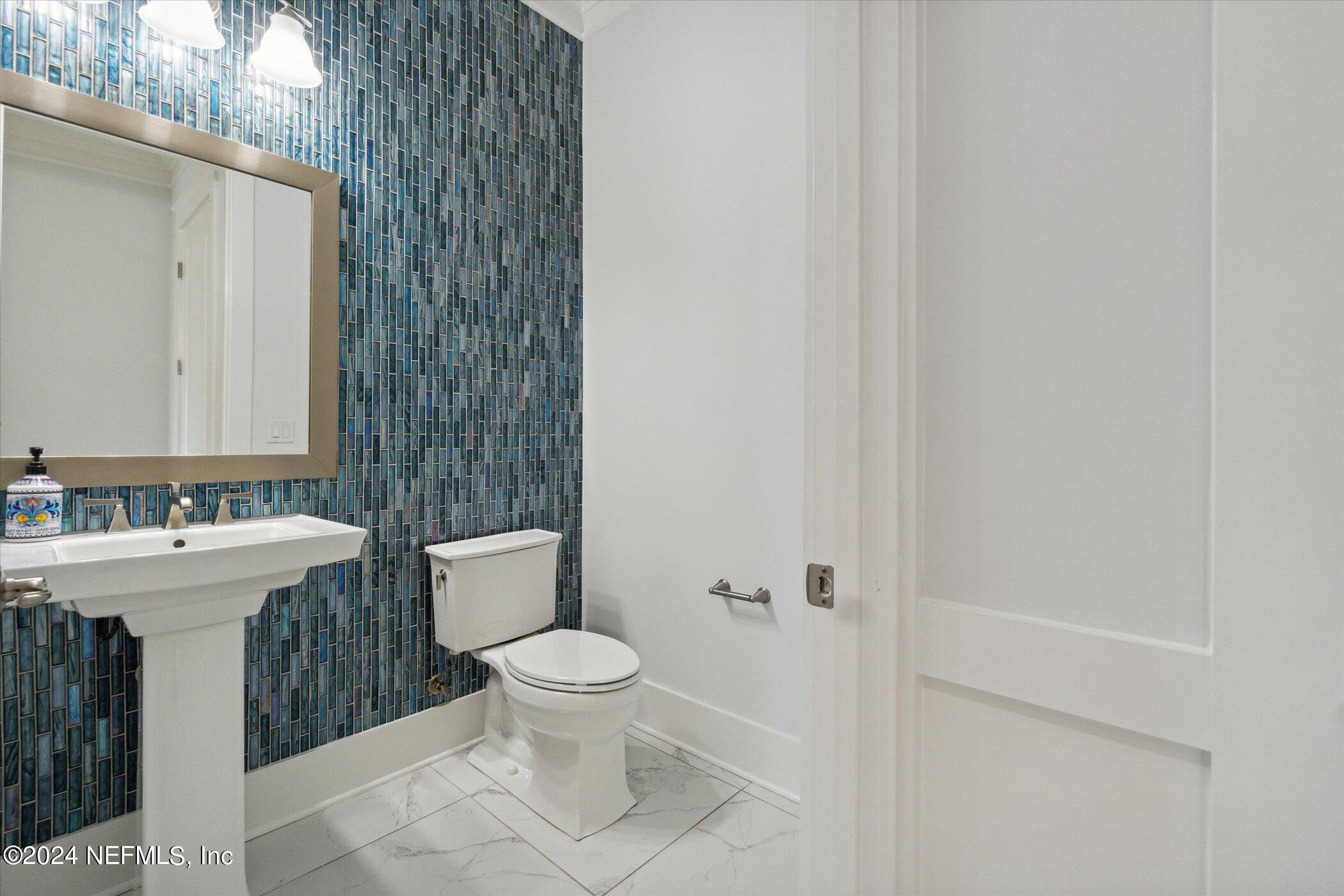 522 Old Bluff Drive Ponte Vedra, FL 32081 - Photo 25 of 93 a bathroom with a sink a toilet and shower