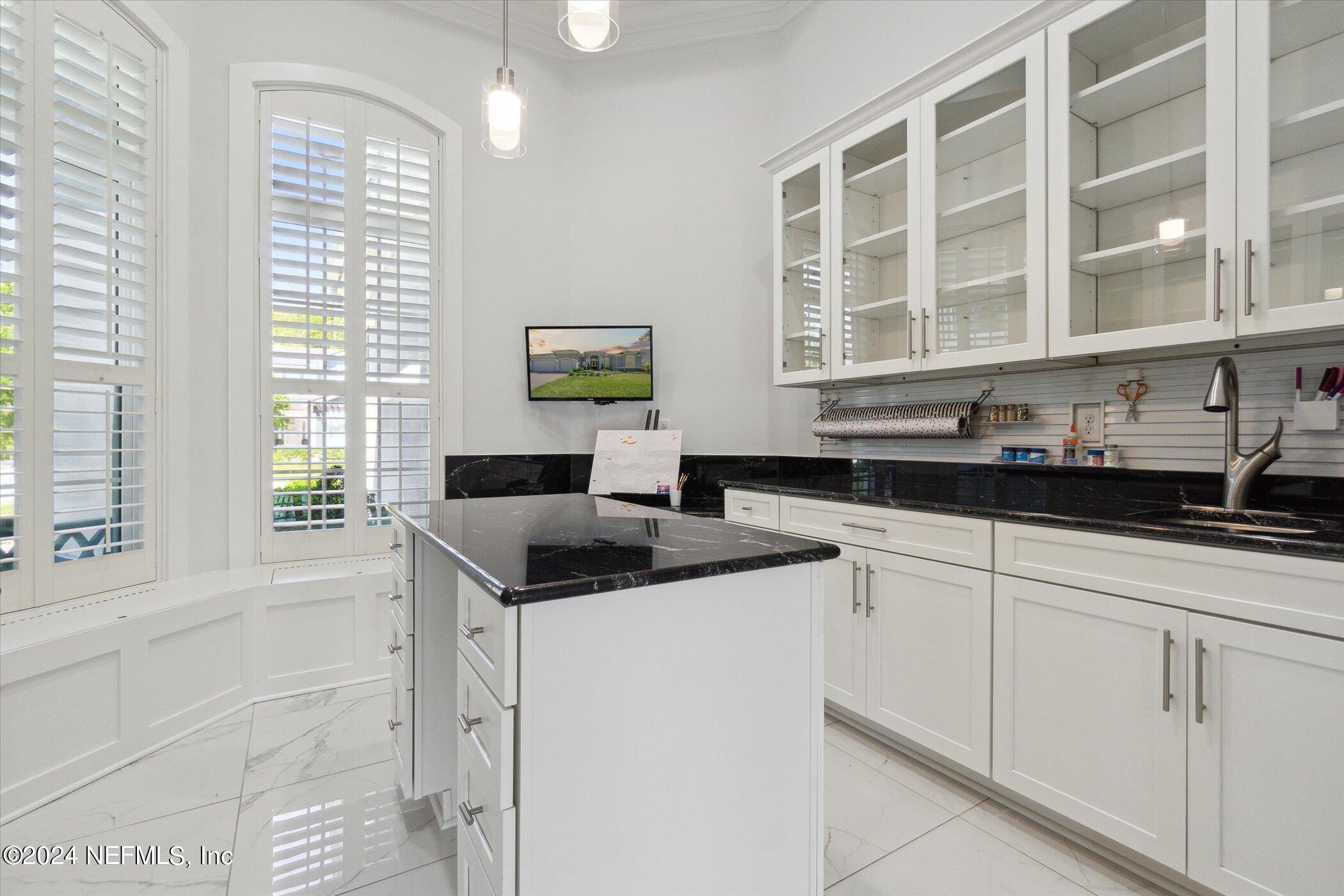 522 Old Bluff Drive Ponte Vedra, FL 32081 - Photo 27 of 93 a kitchen with stainless steel appliances granite countertop a sink and a window