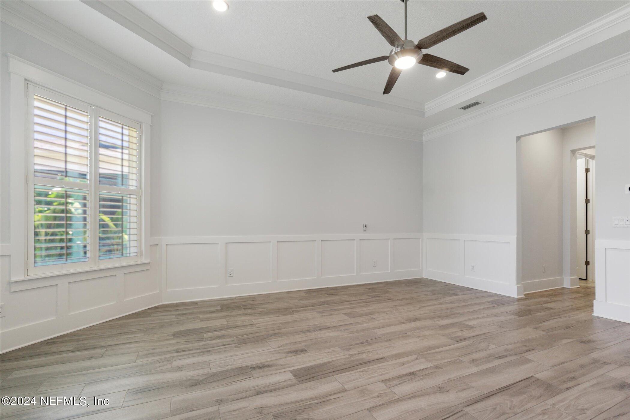 522 Old Bluff Drive Ponte Vedra, FL 32081 - Photo 33 of 93 an empty room with wooden floor and windows