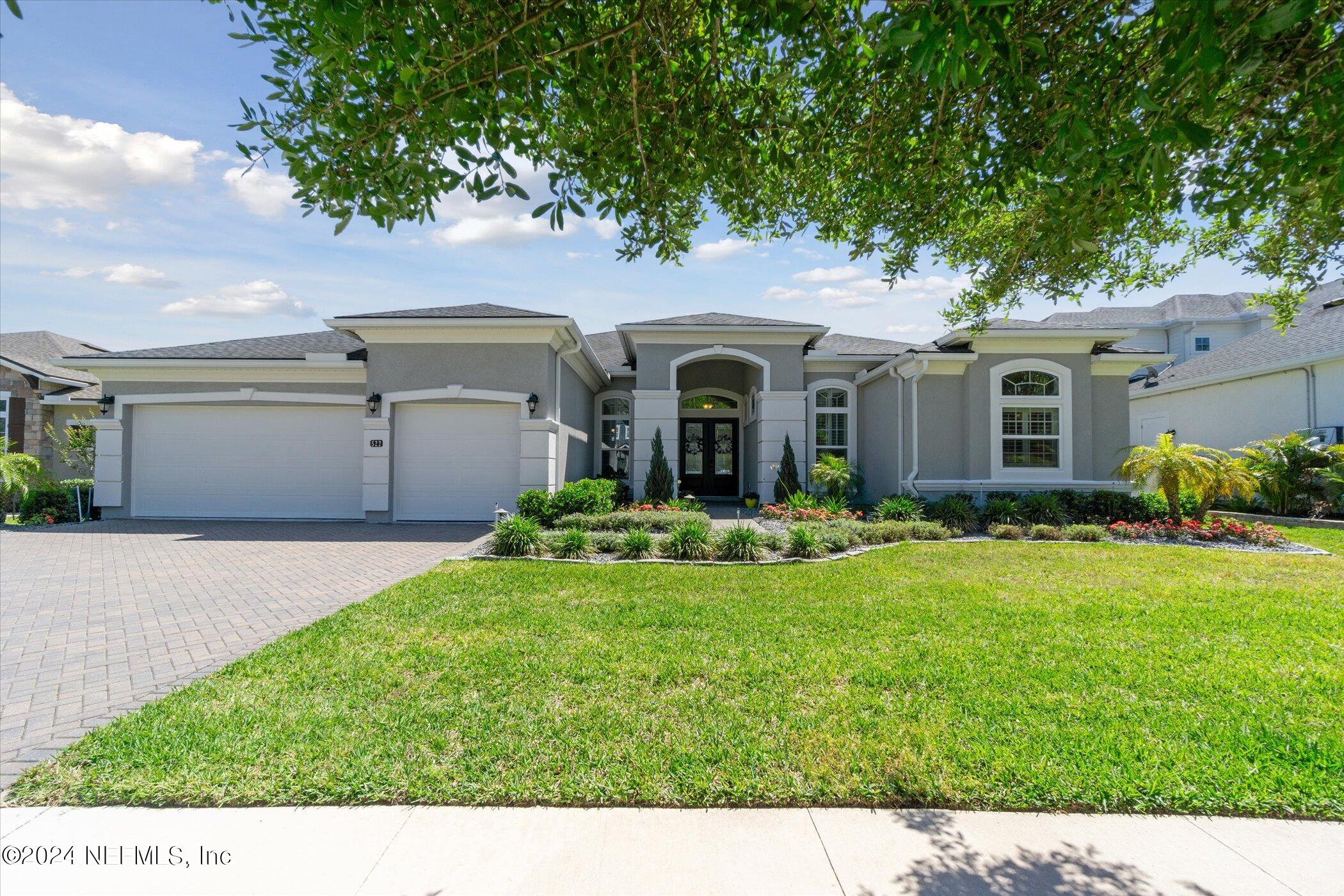 522 Old Bluff Drive Ponte Vedra, FL 32081 - Photo 4 of 93 a front view of a house with a yard and garage