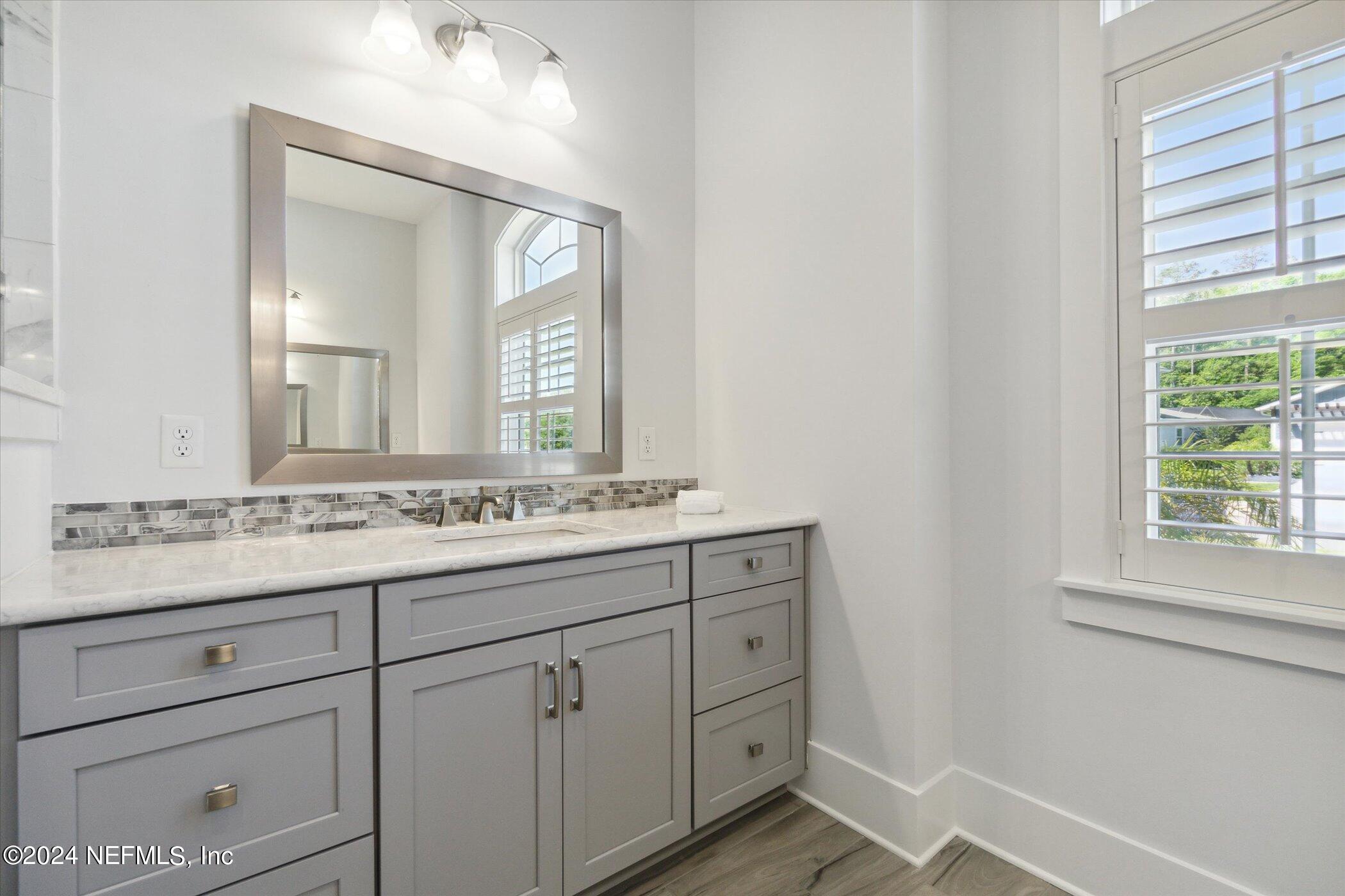 522 Old Bluff Drive Ponte Vedra, FL 32081 - Photo 41 of 93 a bathroom with a sink vanity and mirror