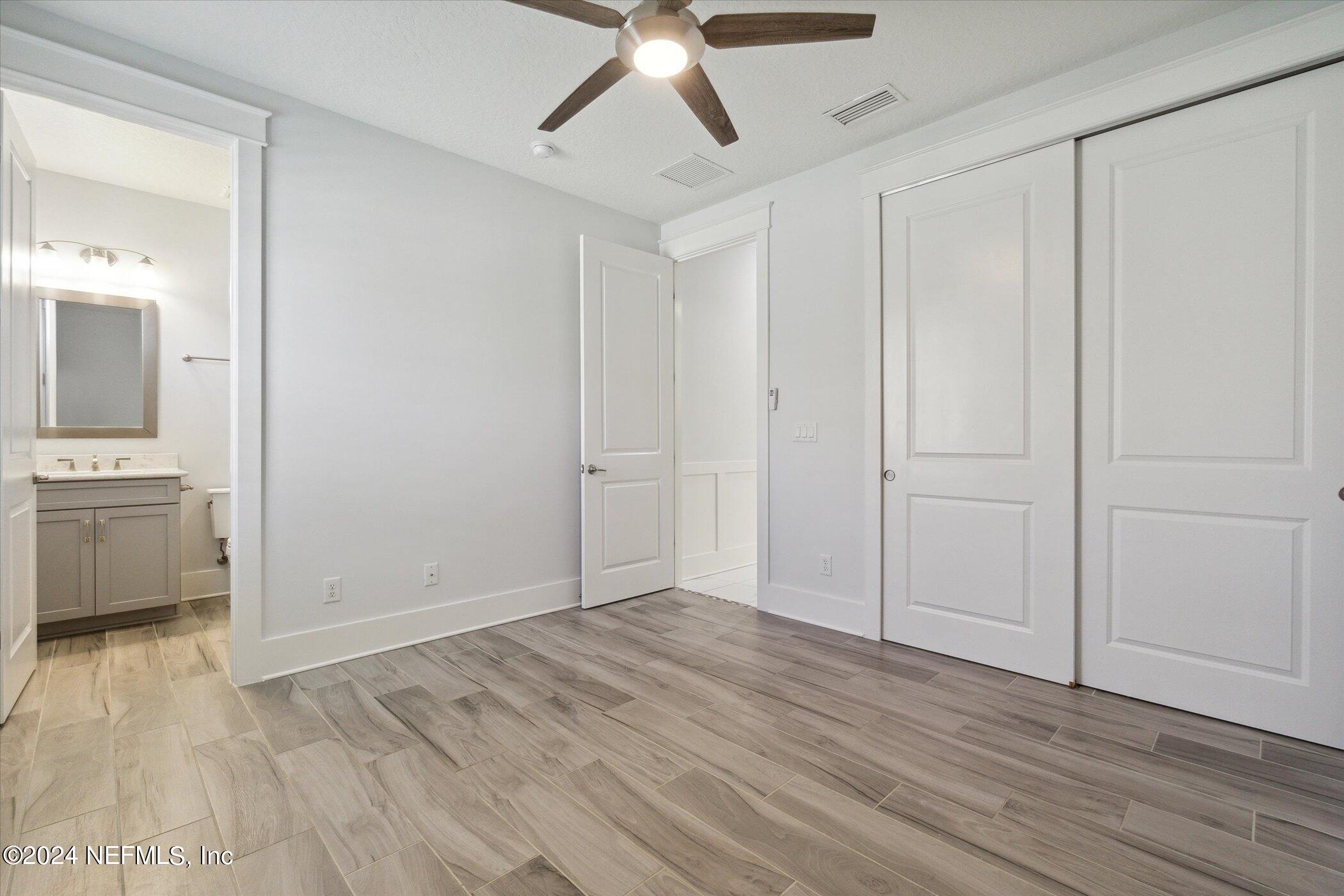 522 Old Bluff Drive Ponte Vedra, FL 32081 - Photo 48 of 93 a view of empty room with wooden floor and ceiling fan