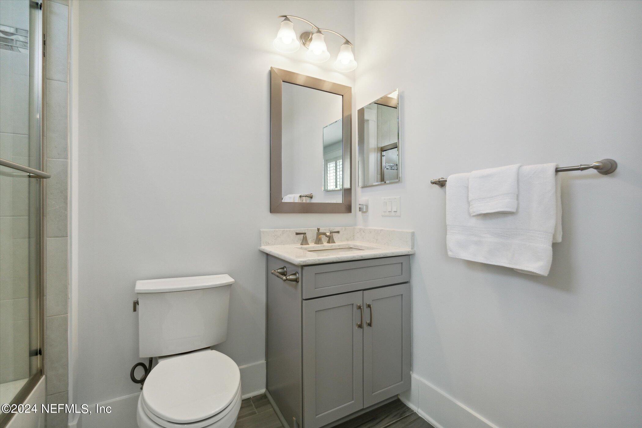 522 Old Bluff Drive Ponte Vedra, FL 32081 - Photo 54 of 93 a bathroom with a sink toilet and mirror