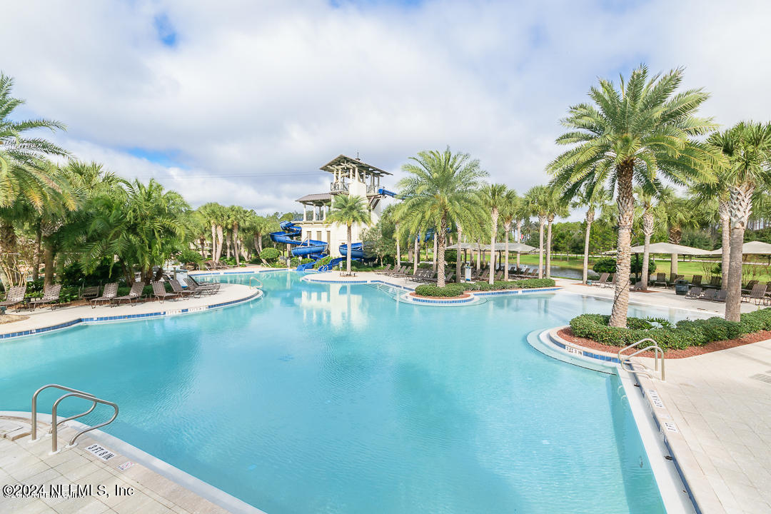 522 Old Bluff Drive Ponte Vedra, FL 32081 - Photo 75 of 93 a view of a swimming pool with an outdoor space and seating area