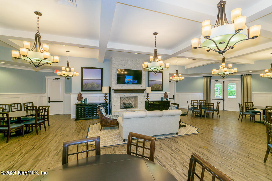 522 Old Bluff Drive Ponte Vedra, FL 32081 - Photo 84 of 93 a living room with fireplace furniture and a chandelier